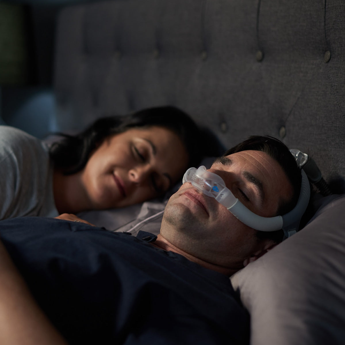 Man in Bed Wearing AirFit n30i Mask
