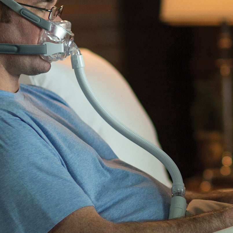 Man Awake in Bed Wearing Amara Mask
