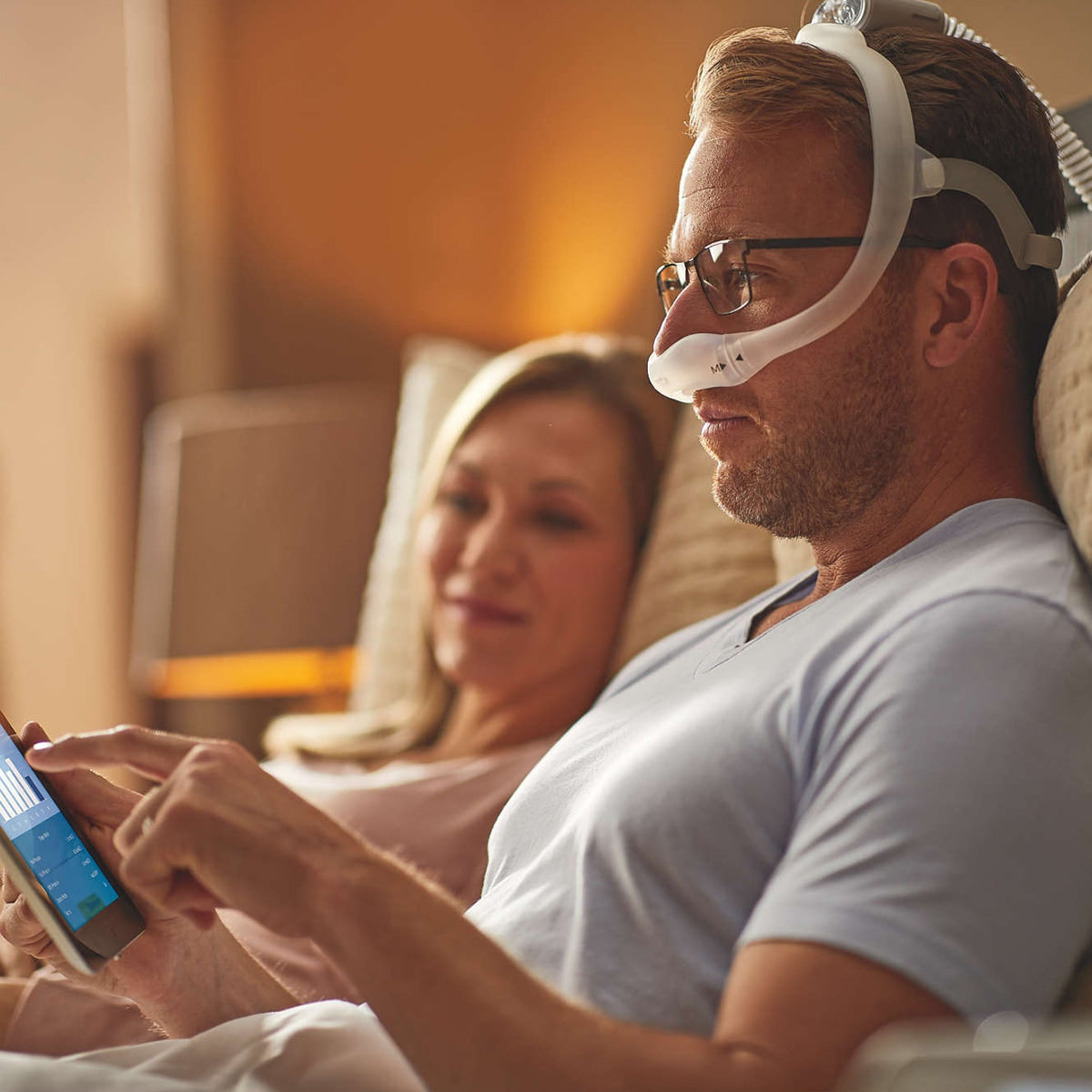 Man In Bed Reading With Dreamwear Mask On