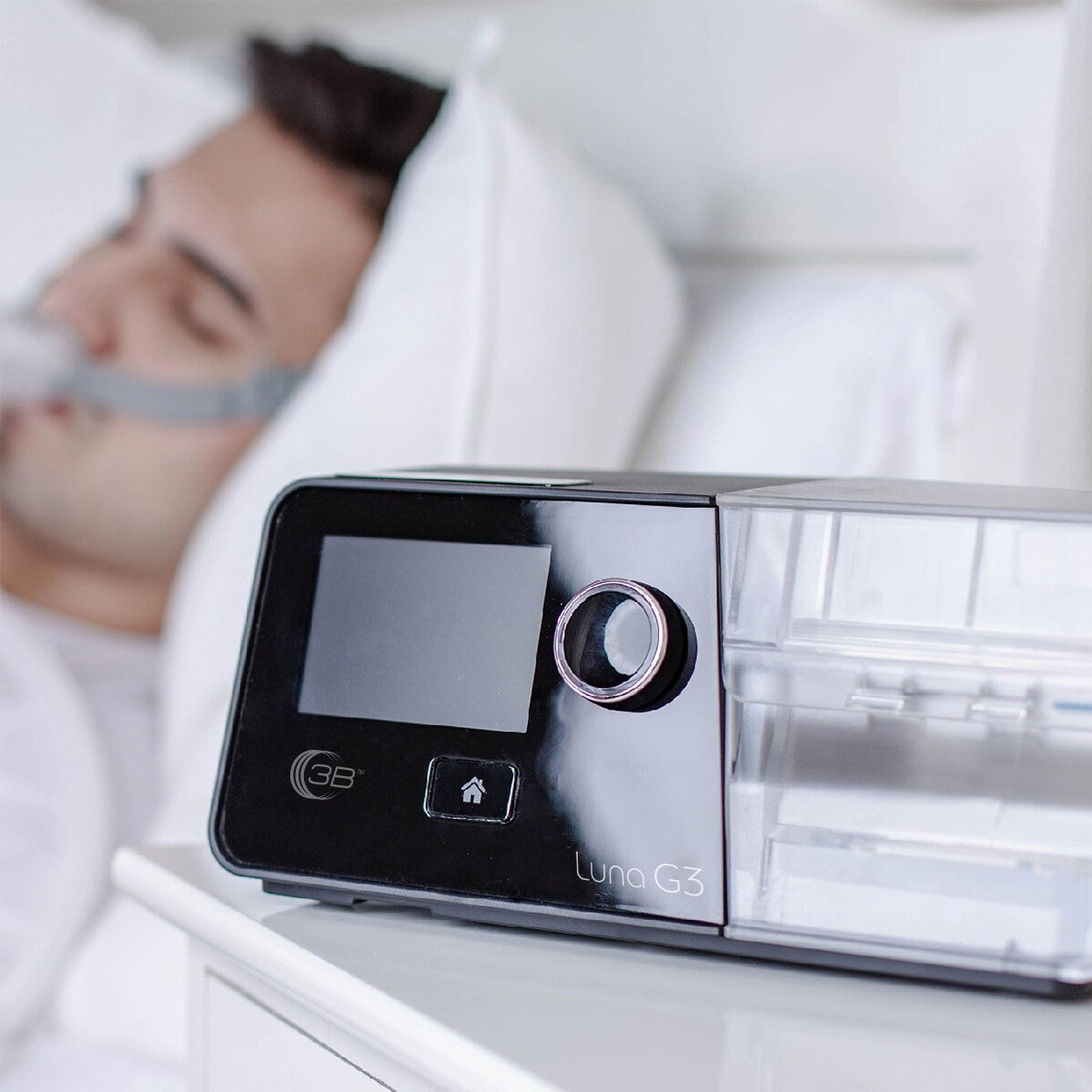 Man Sleeping with Luna G3 CPAP in Foreground