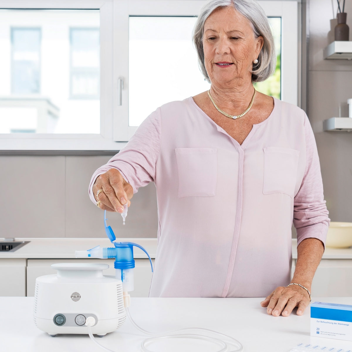 Lady Putting Liquid Into Nebulizer