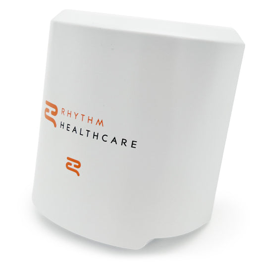 A white battery pack with the Rhythm Healthcare logo printed on it.