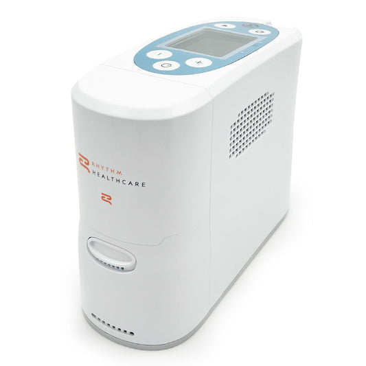 A portable oxygen concentrator with a white casing, digital display, and control buttons.