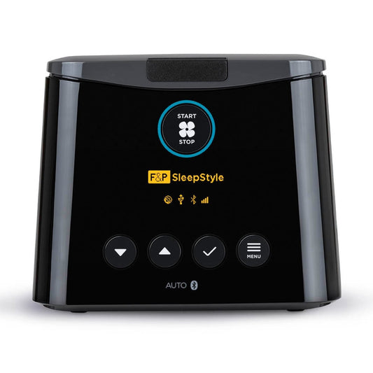 Front view of a black F&P SleepStyle Auto-CPAP machine with a heated humidifier, featuring a display screen and control buttons.