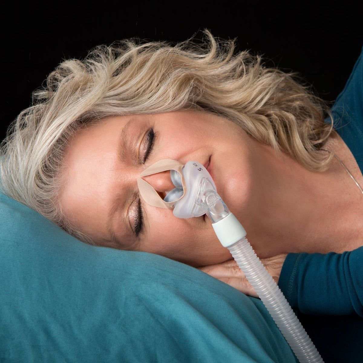 Woman wearing NozeSeal Adhesive Strips