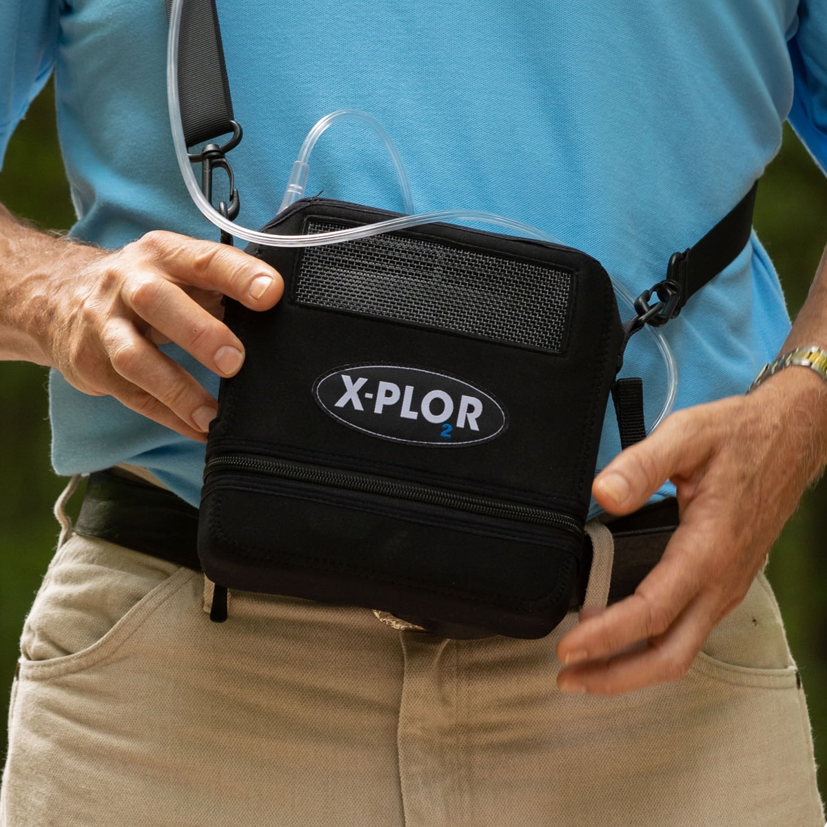 Man Holding Small X-Plor Oxygen Concentrator