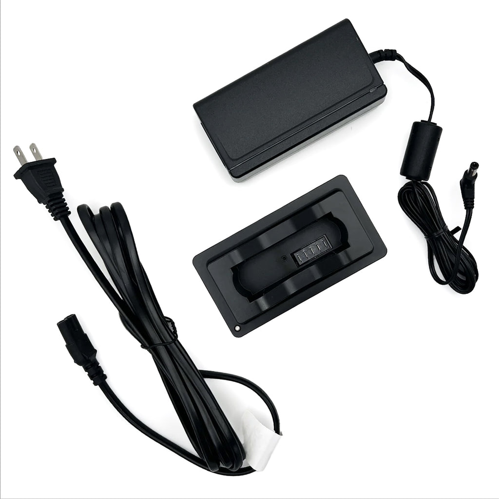 Black electronic components including a power adapter and cables on a white background