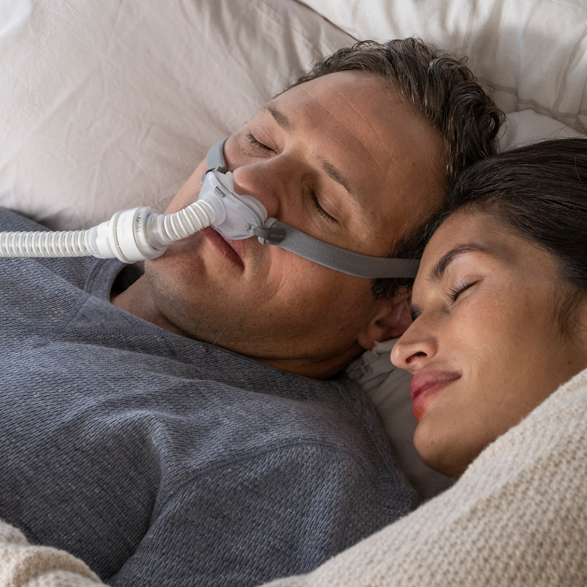Man Wearing AirFit P10 CPAP Mask with AirMini Machine