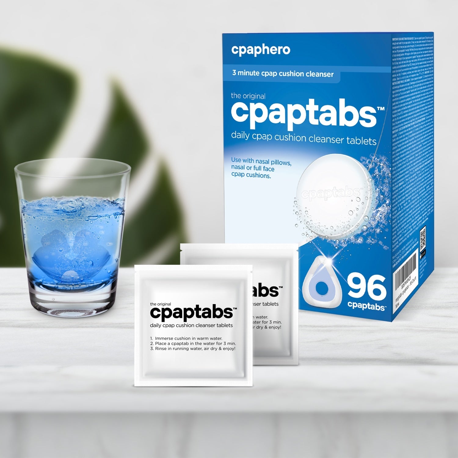 cpaptabs packaging with a glass of water on a white surface