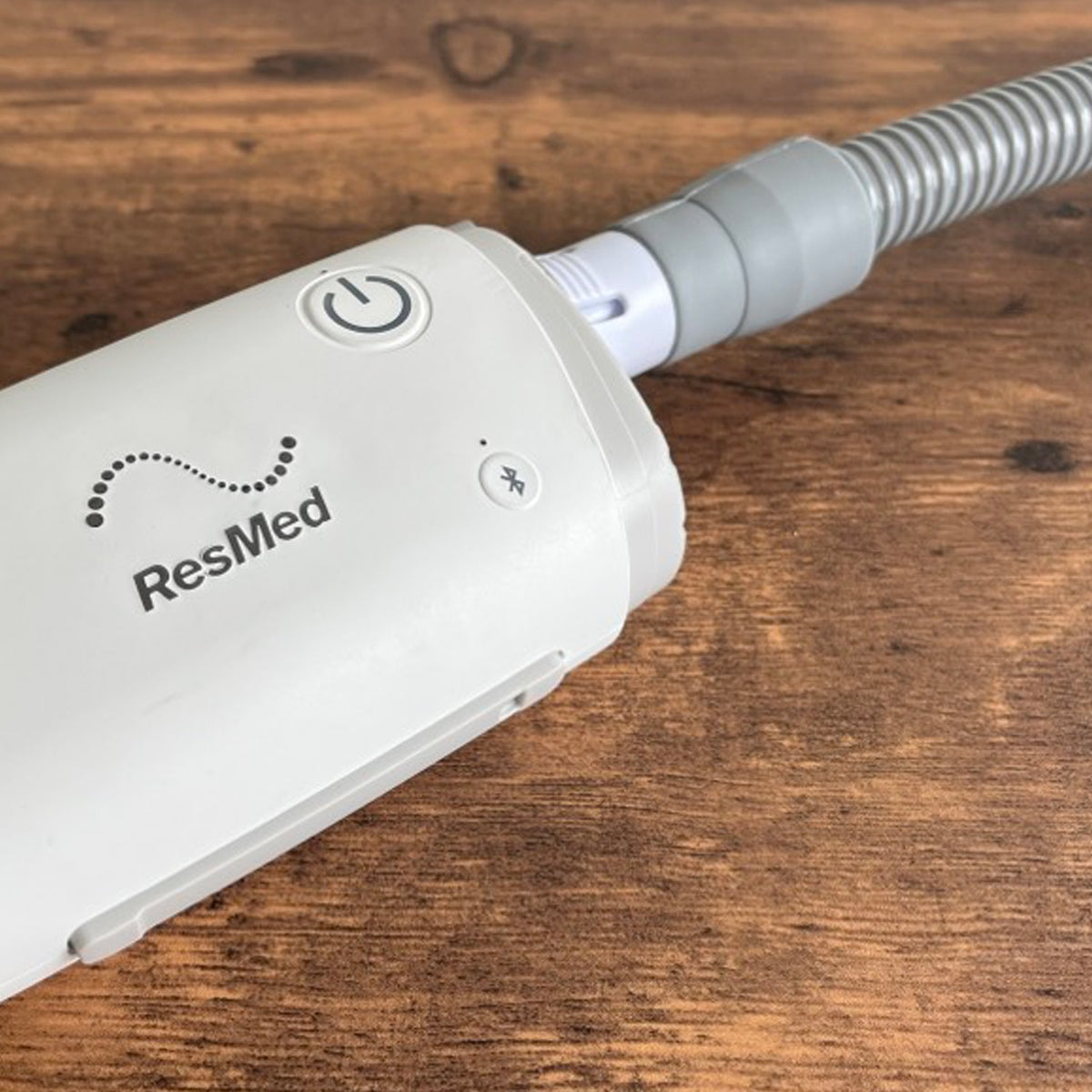 ResMed device on a wooden surface