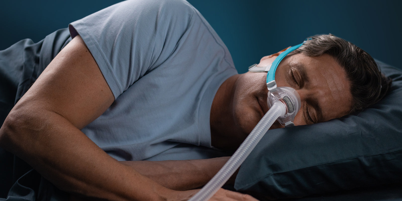 Person using a CPAP mask while sleeping
