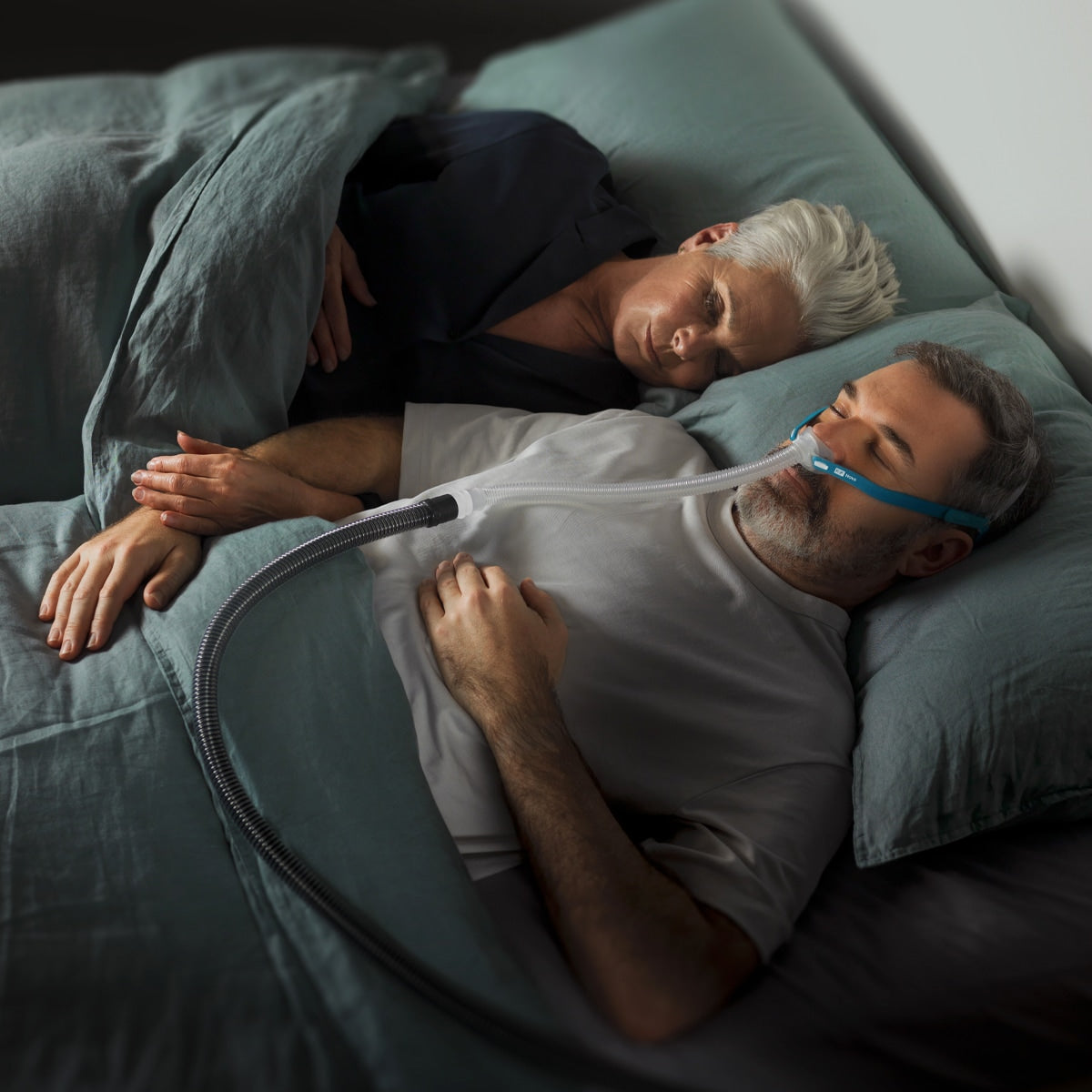 Man Sleeping In Bed With Nova Micro Mask on 