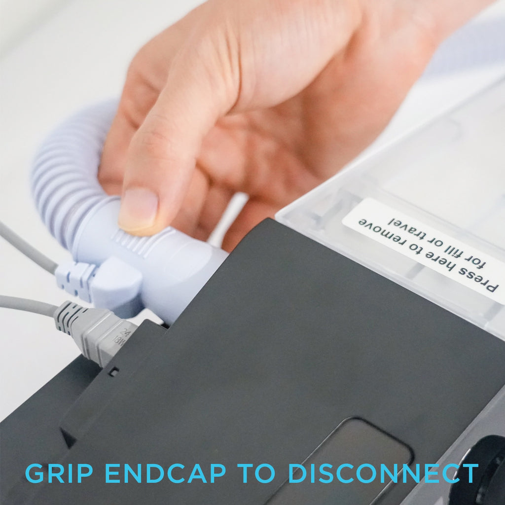 Hand disconnecting heated tubing from a CPAP Machine 