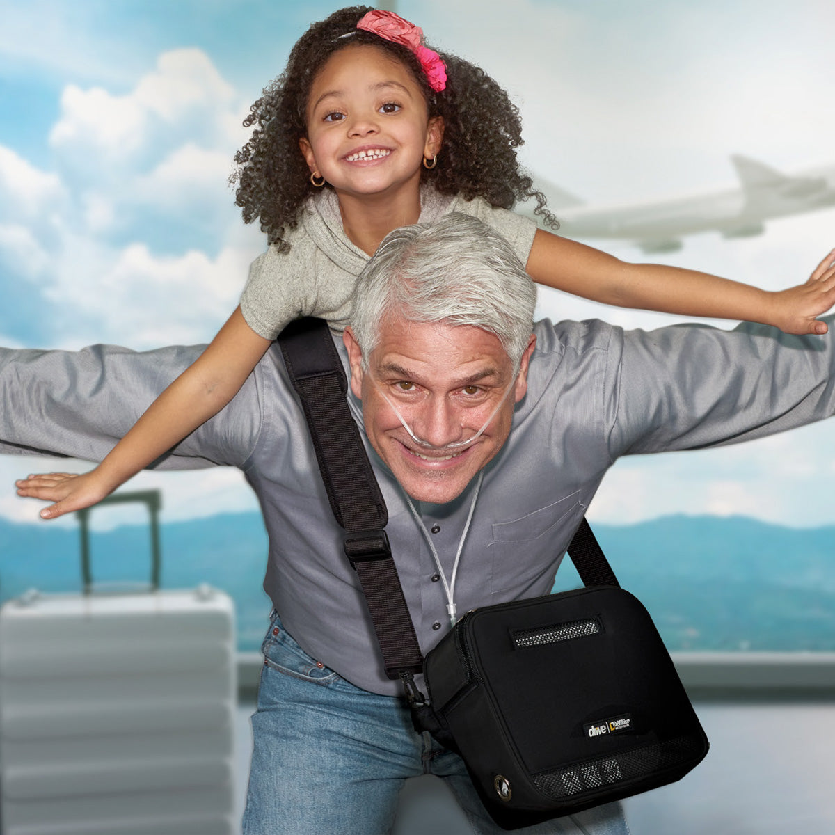 Man using an iGo 2 POC in an airport with his daughter