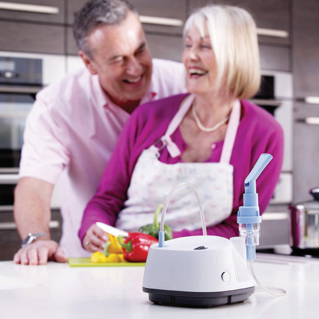 Inspire Elegance on a counter with a woman and man behind cooking