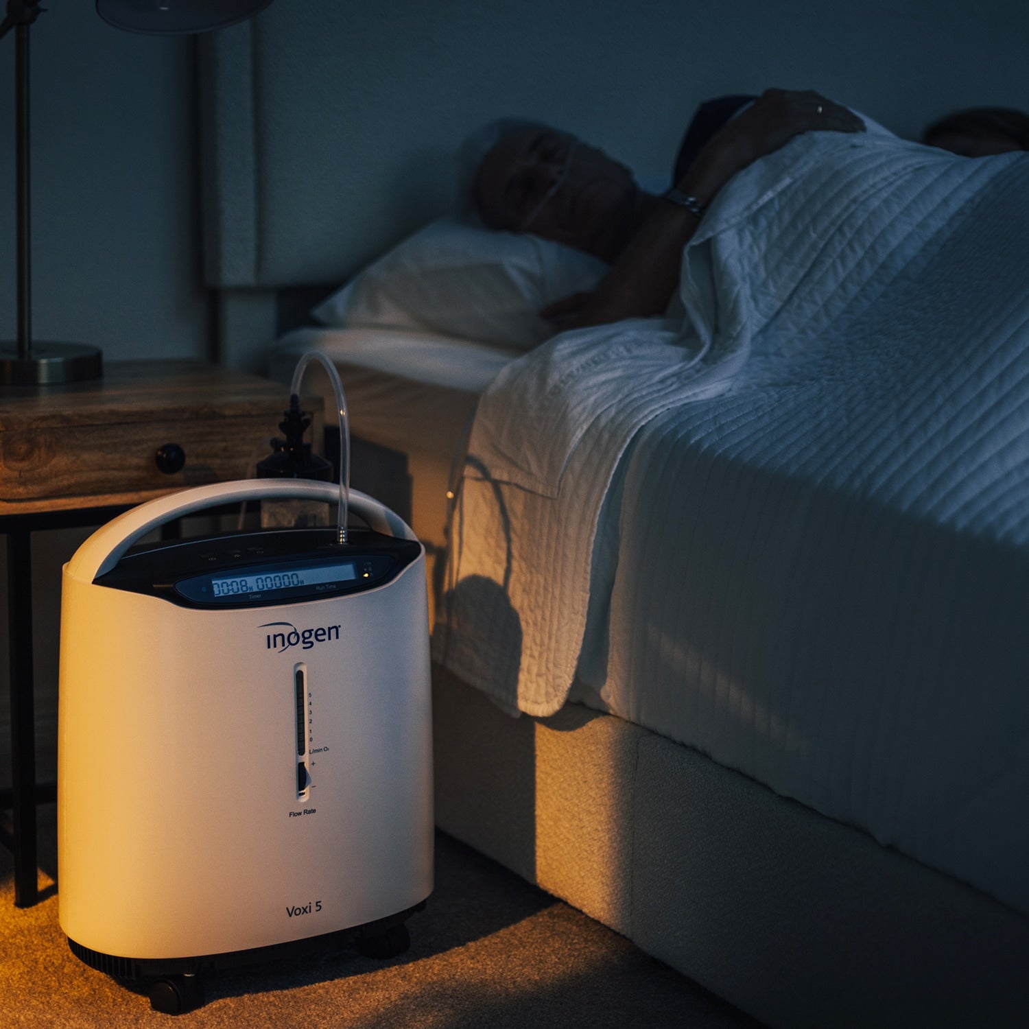 Lady Sleeping with the Inogen Voxi 5 Oxygen Concentrator 