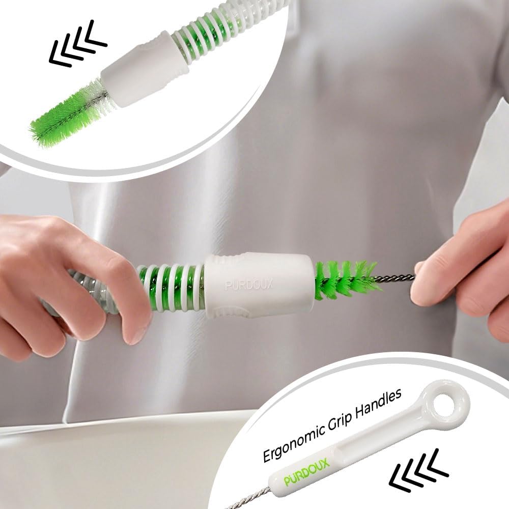 Cleaning brush with green bristles and ergonomic white handle, held by hands against a neutral background.