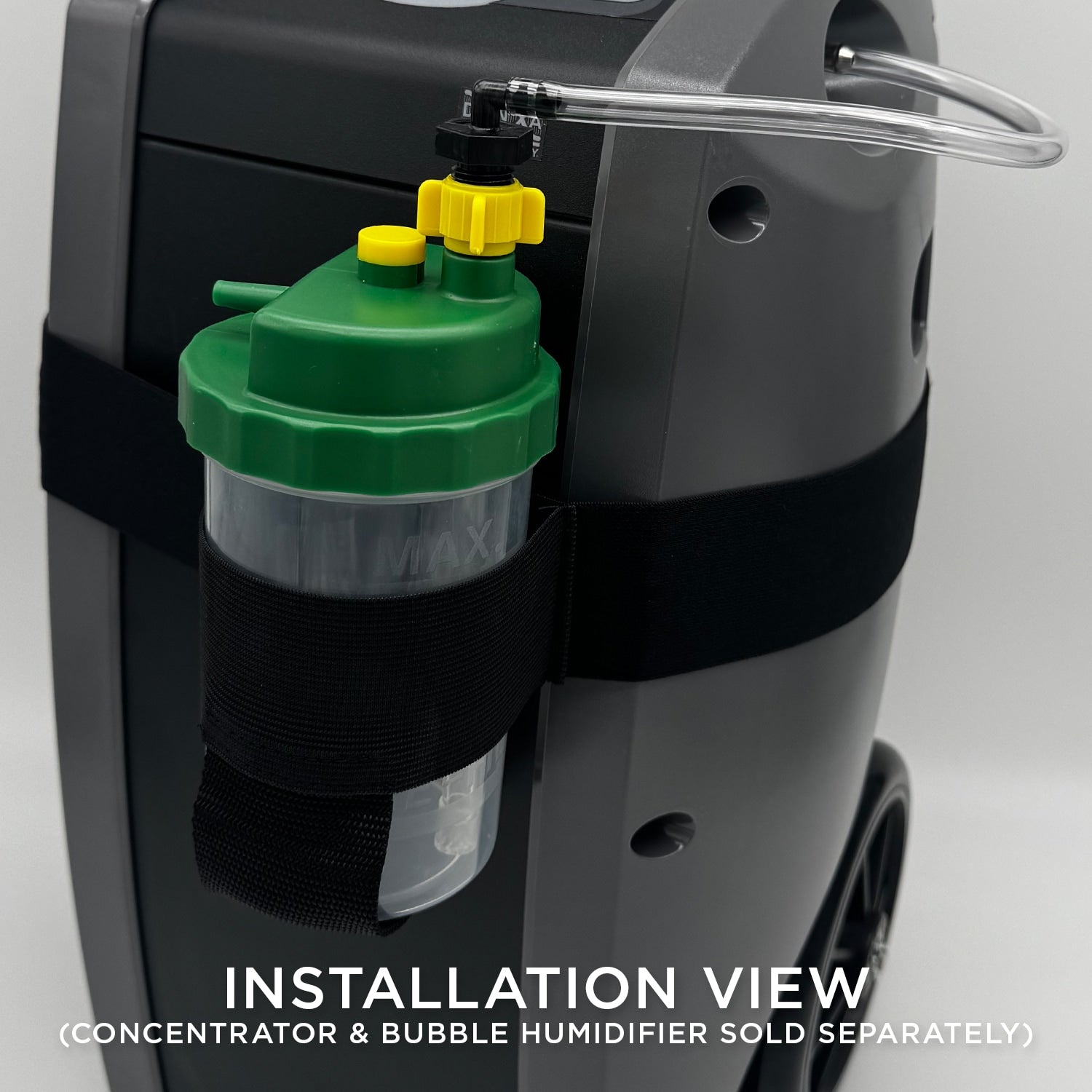 Close-up of a green and yellow component attached to a black machine with text indicating installation view.