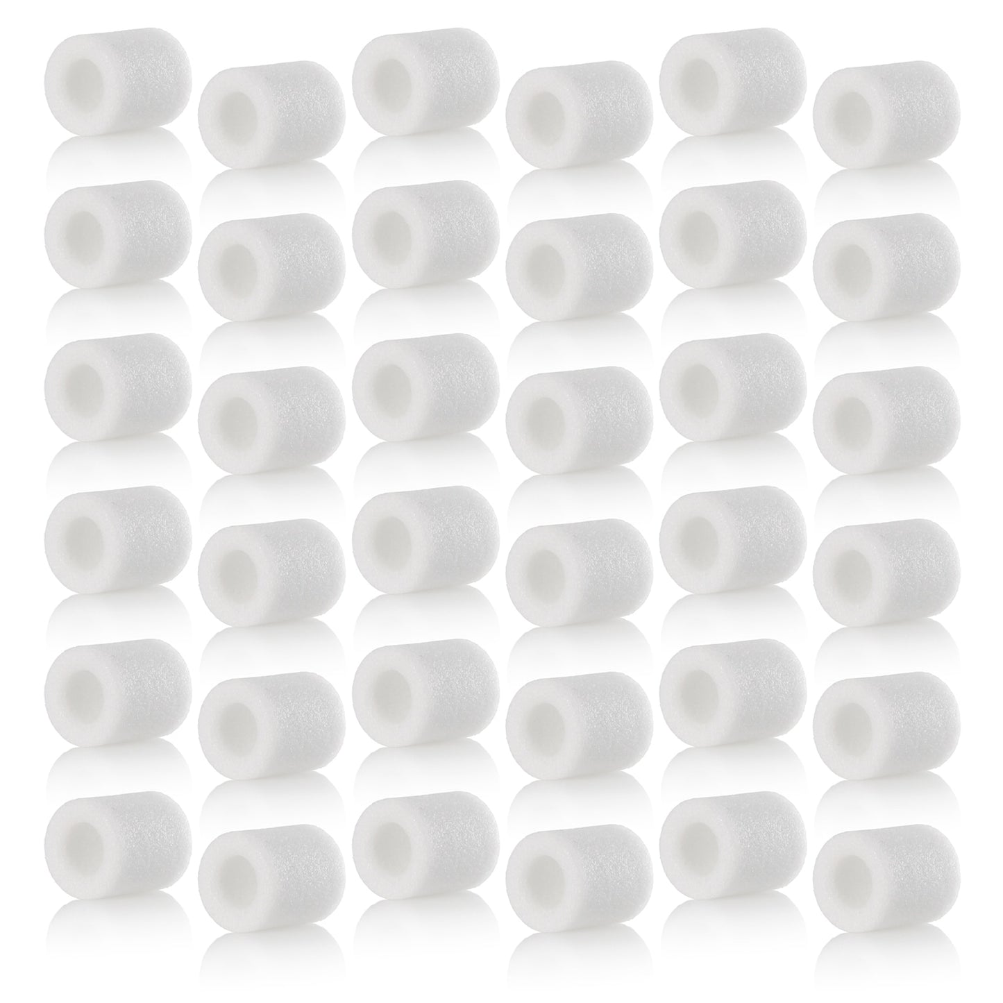 Multiple white cylindrical filters arranged in rows on a white background