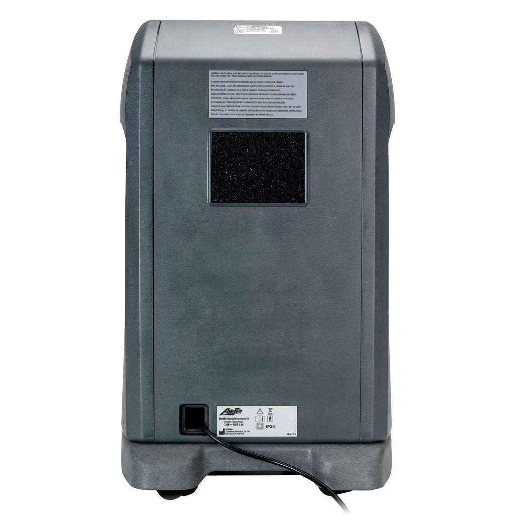 Gray electronic device with a power cord on a white background