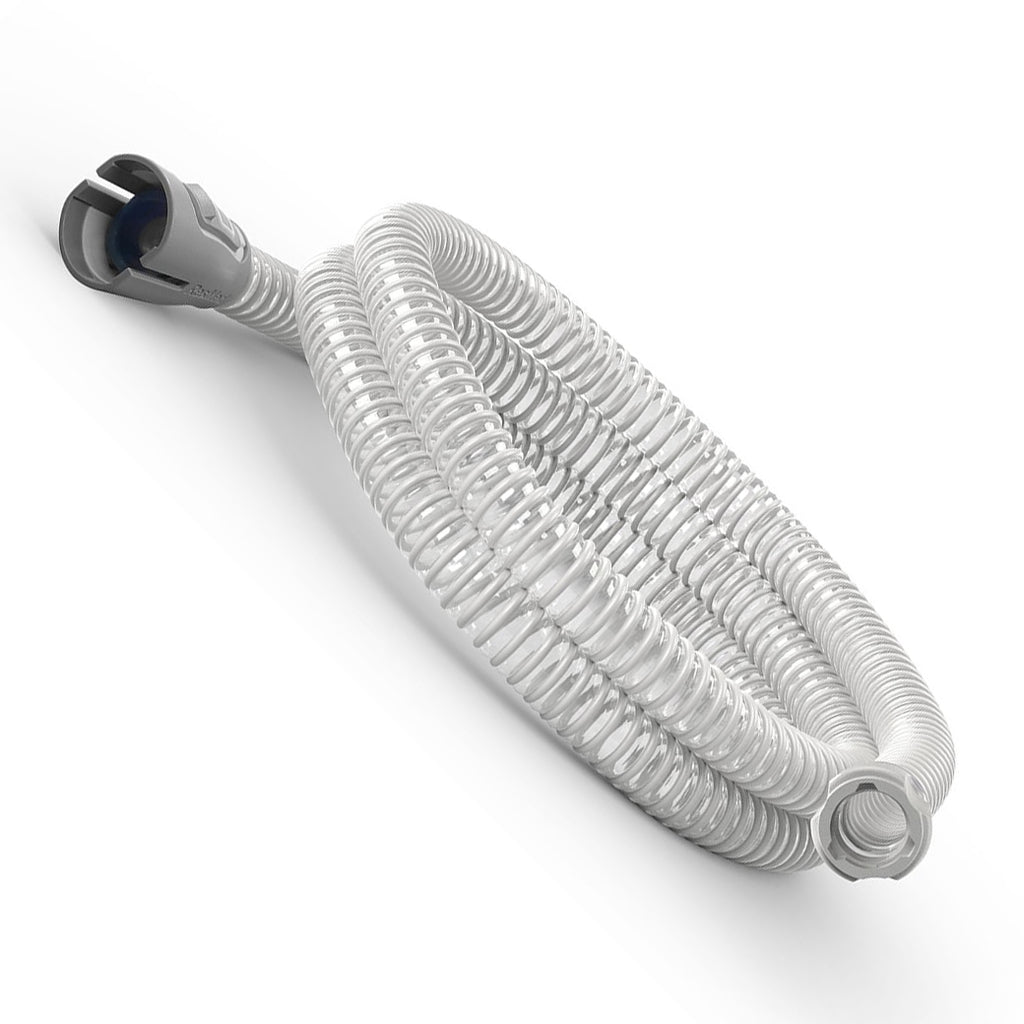 Coiled white hose with a metal fitting on a white background