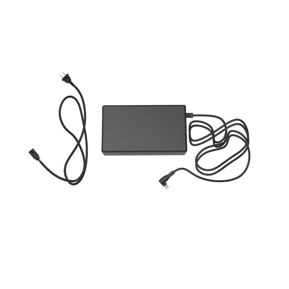 Rectangular electronic device with two cables on a white background