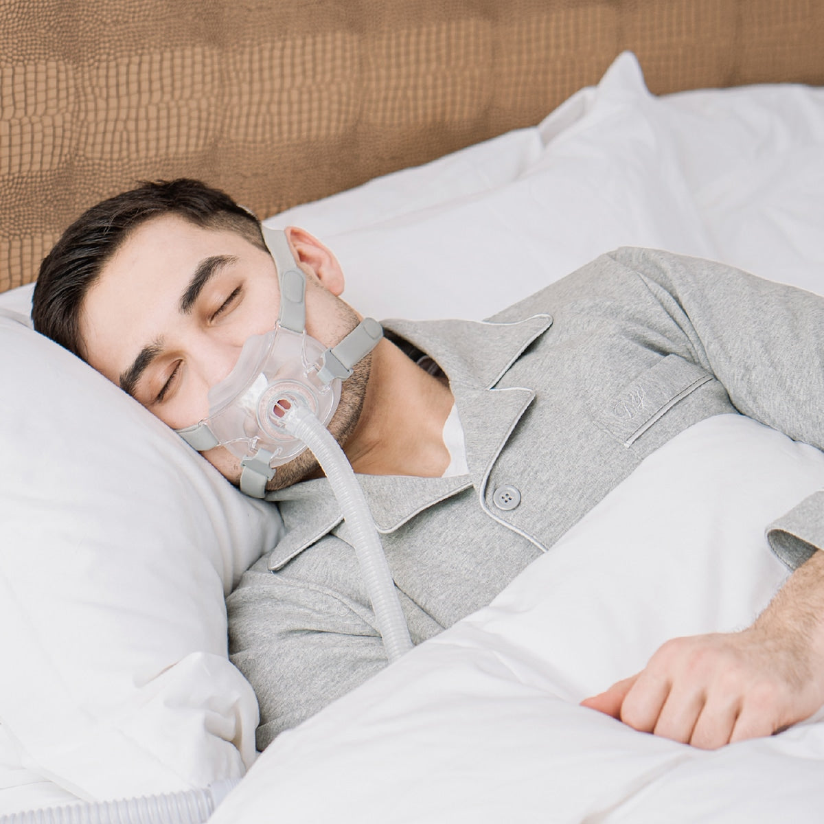 man sleeping wearing rio ii full face cpap mask