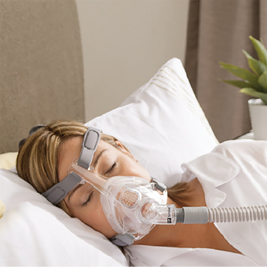 woman wearing full face cpap mask