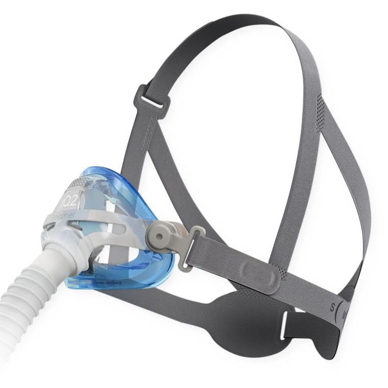 CPAP mask with gray strap and blue cushion on a white background