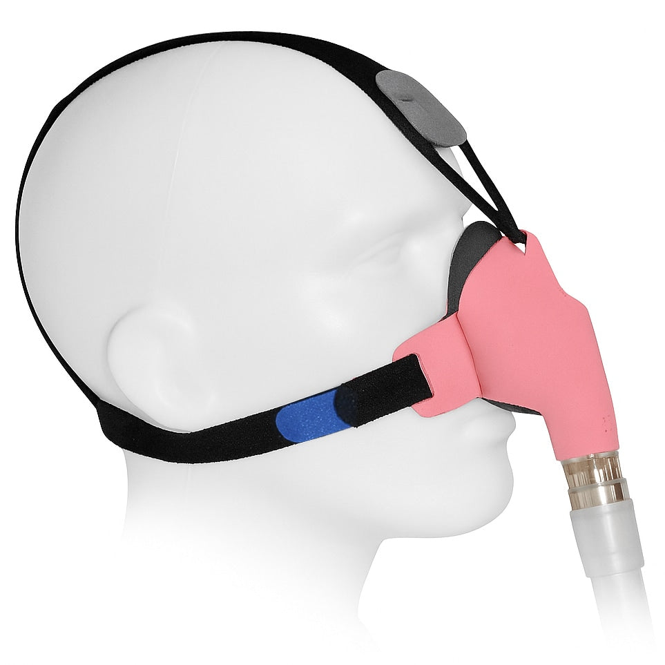 Headgear with pink mask and black strap on a mannequin head against a white background