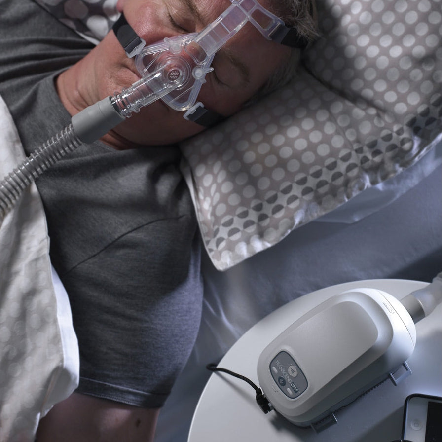 Man Sleeping with Transcend II Mini CPAP