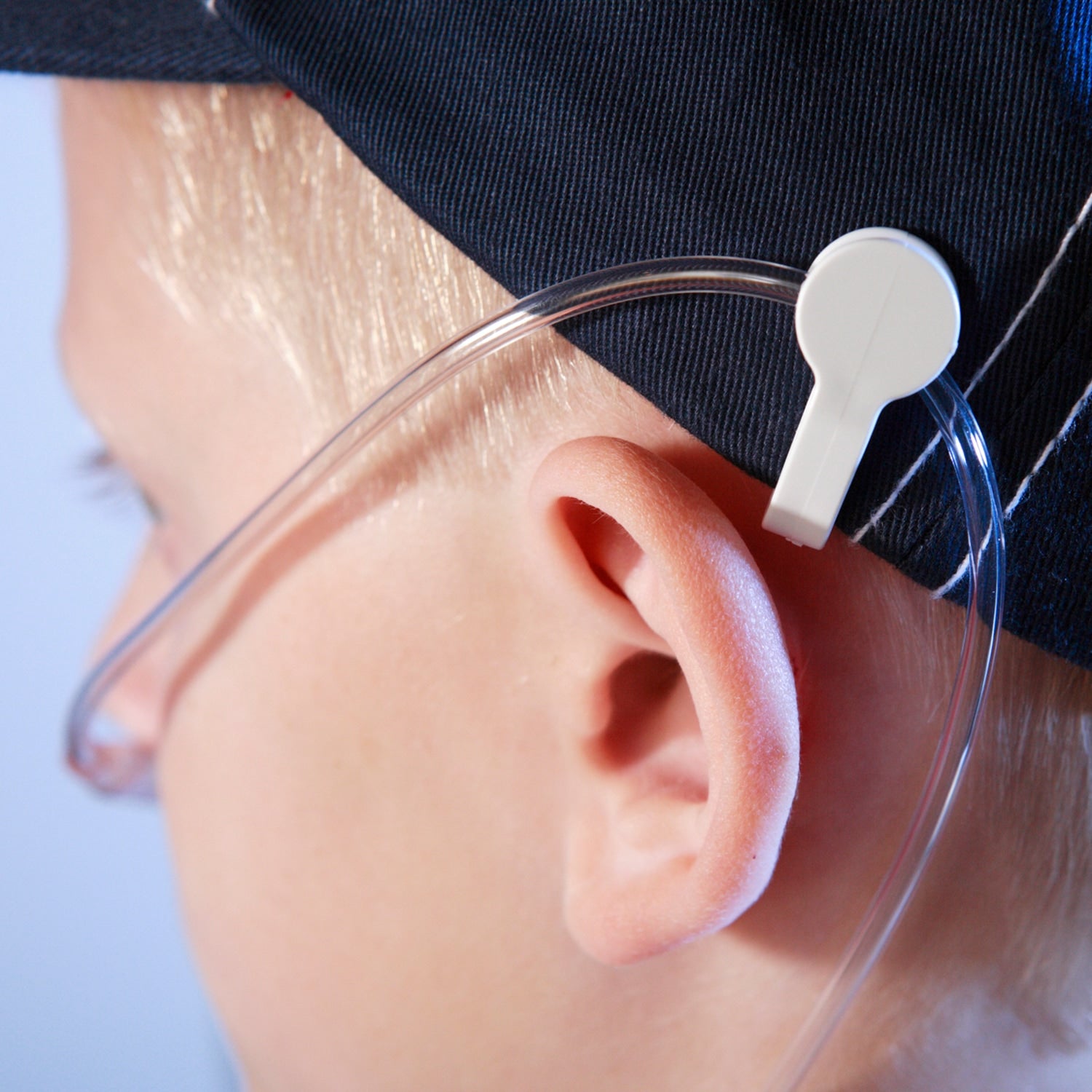 man wearing 02 ear buddies cannula clips