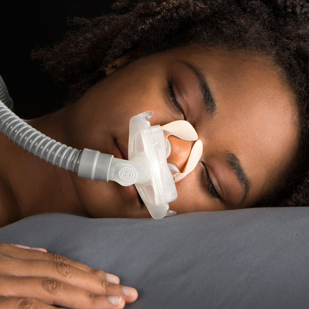 Woman wearing NozeSeal Adhesive Strips while sleeping 