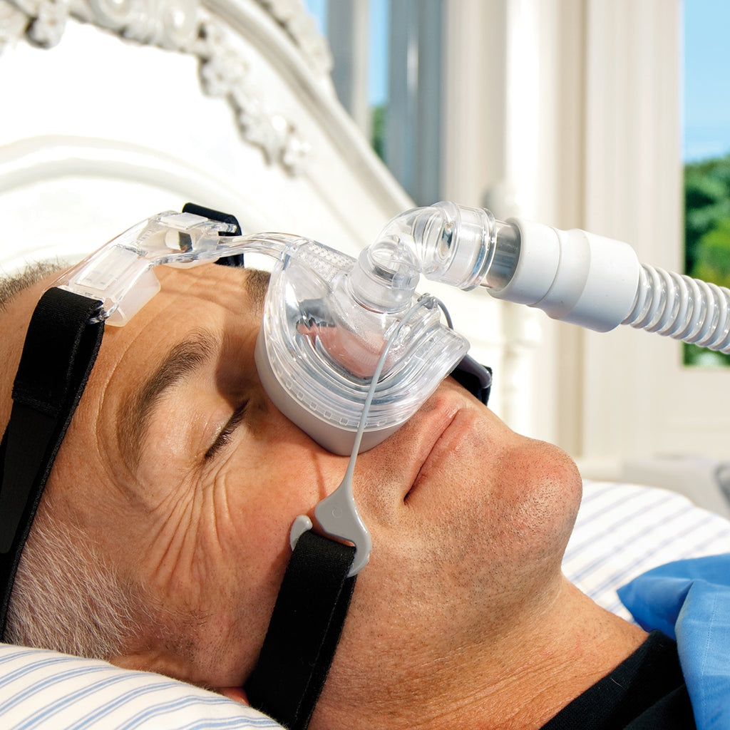 Man Wearing Zest CPAP Mask in Bed