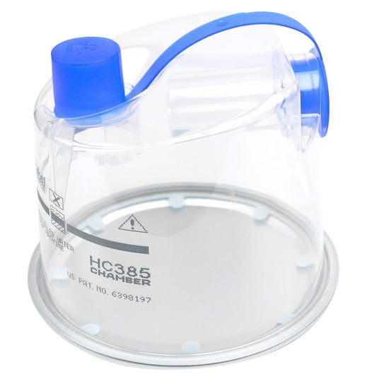 Clear humidifier chamber with blue lid on a white background