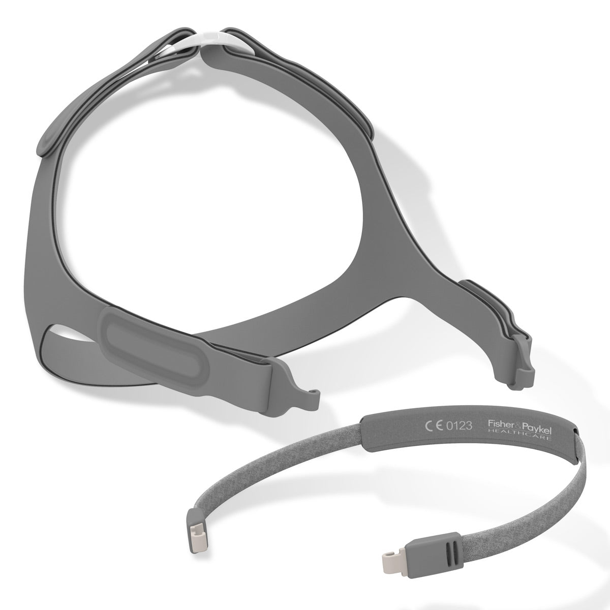 Gray CPAP mask and headgear on a white background