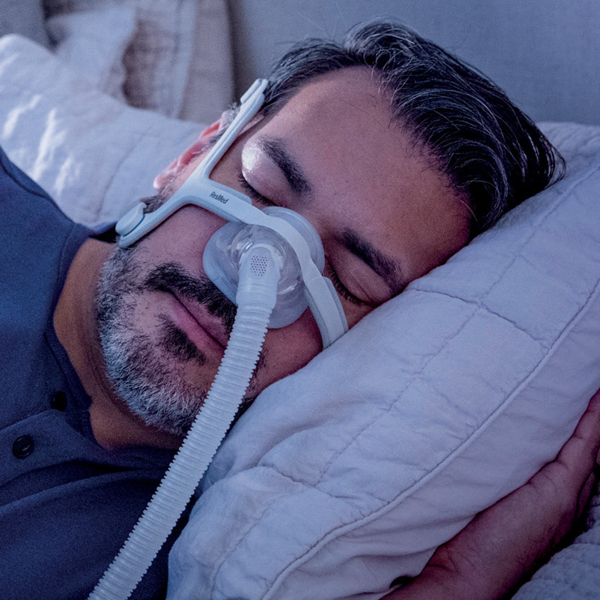 Airtouch N20 CPAP Mask on man while sleeping 