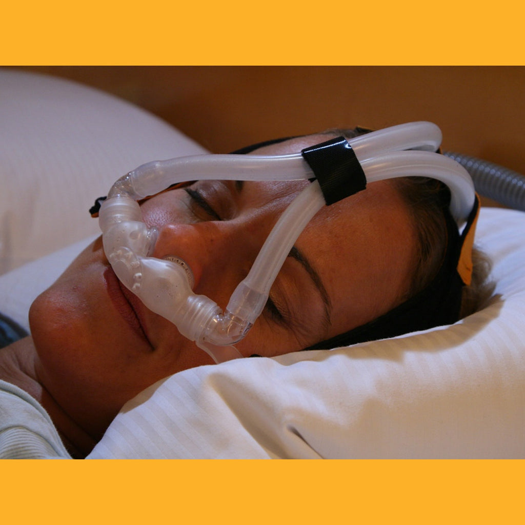 Woman In Bed Wearing Bravo Nasal Pillow Mask 