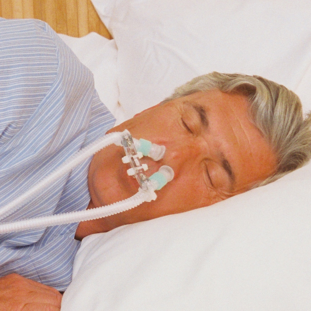man sleeping while wearing a cpap pro nomask cpap interface