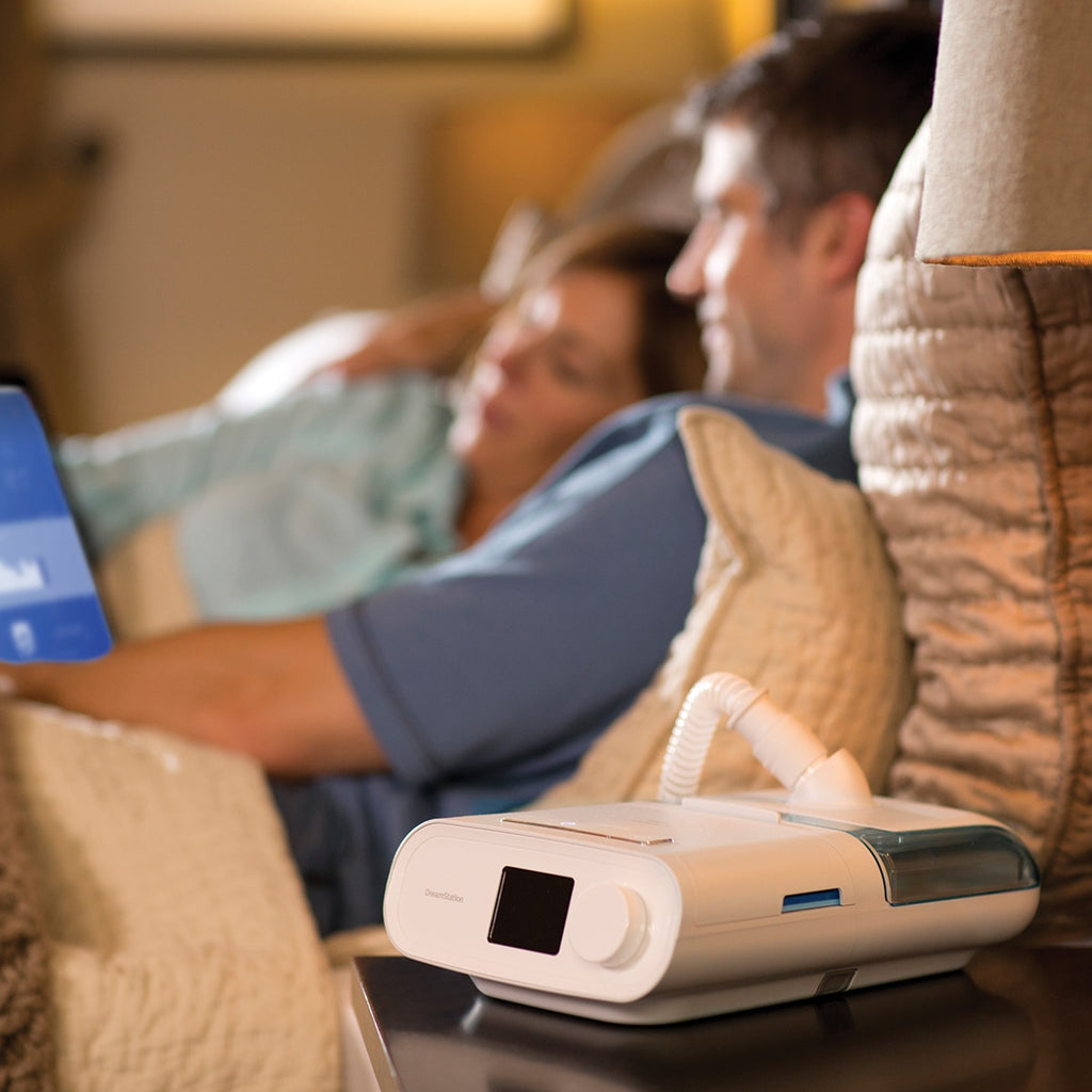 dreamstation cpap heated humidifier in use with tablet app showing