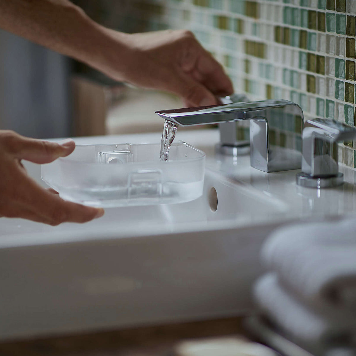 Filling a Dreamstation Go Heated Humidifier under a faucet 