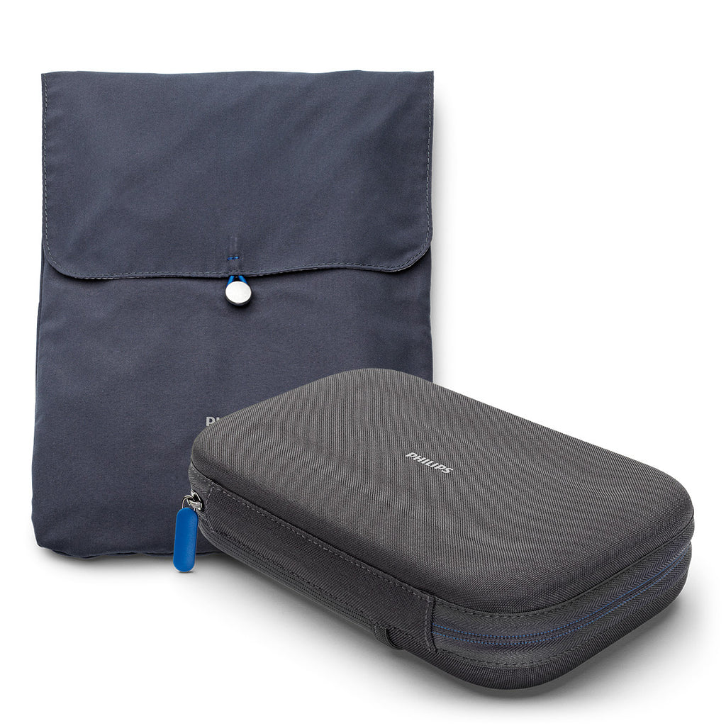 A gray Philips DreamStation Go travel case with a zipper and a blue Philips logo on the front, accompanied by a matching gray accessory bag.