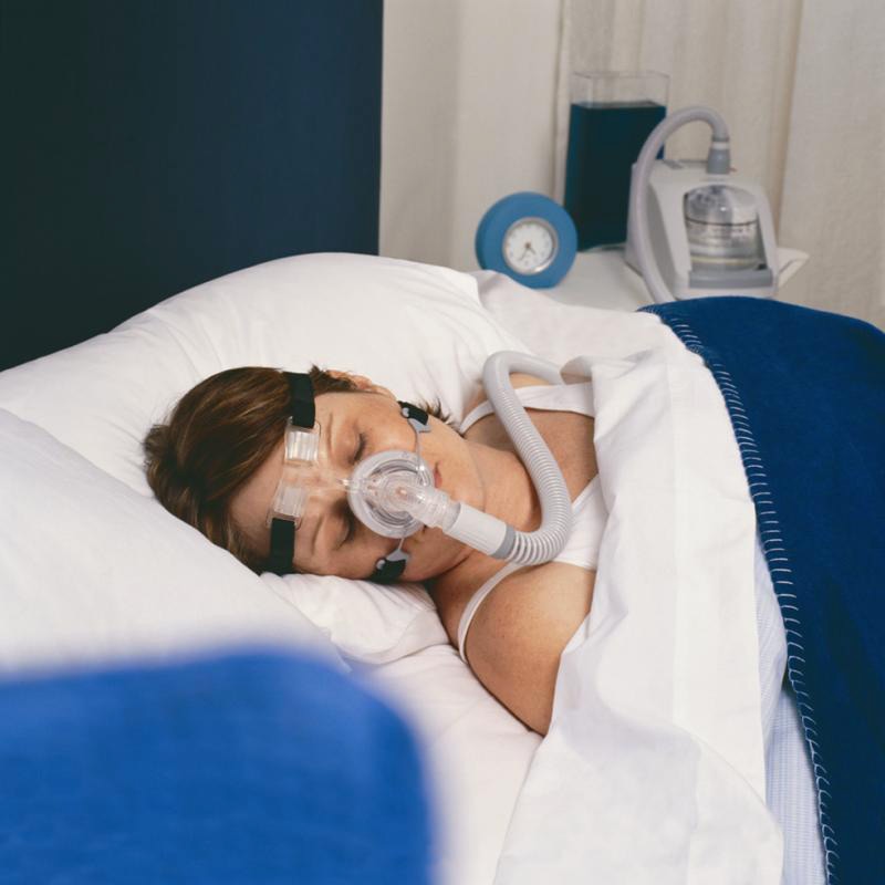 FlexiFit 406 CPAP Mask on Woman In bed 