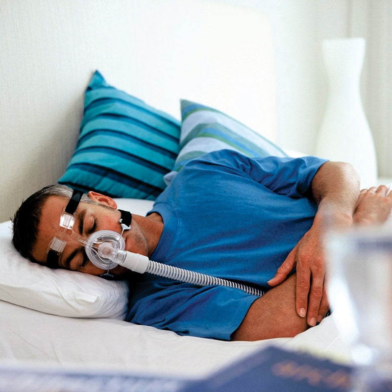 Man In Bed Wearing FlexiFit 407 CPAP Mask 