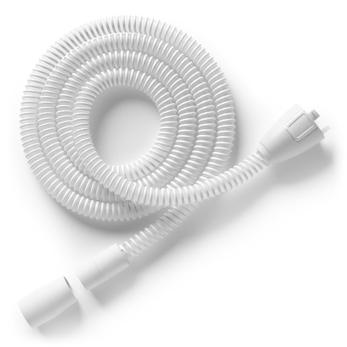 Coiled white hose with connectors on a white background