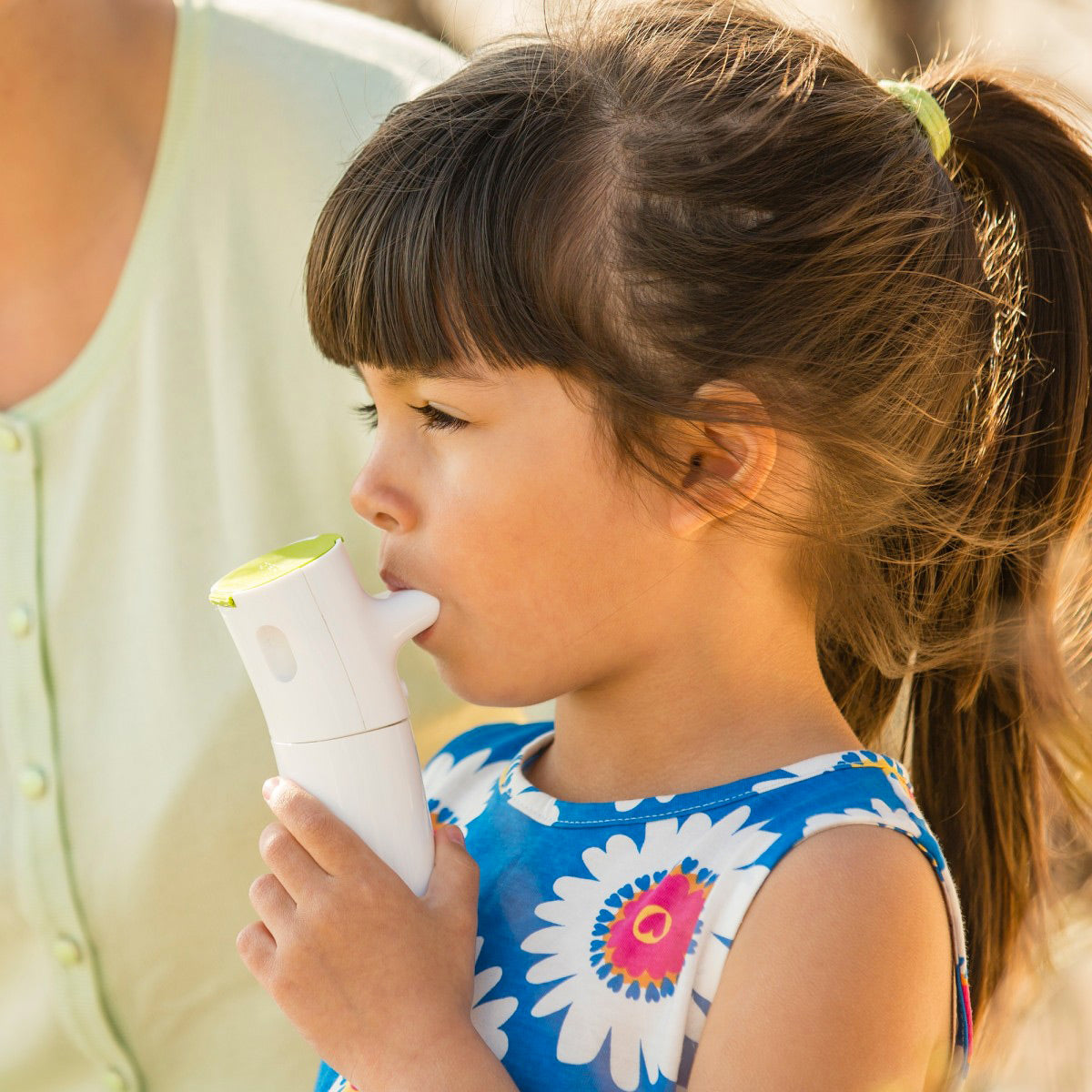 Little Girl Using an Innospire Go Portable Nebulizer 