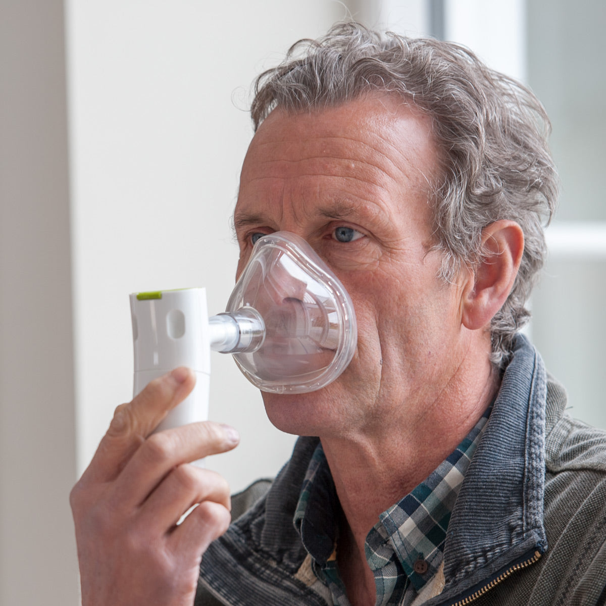 Man Wearing Innospire Go with a Face Mask 