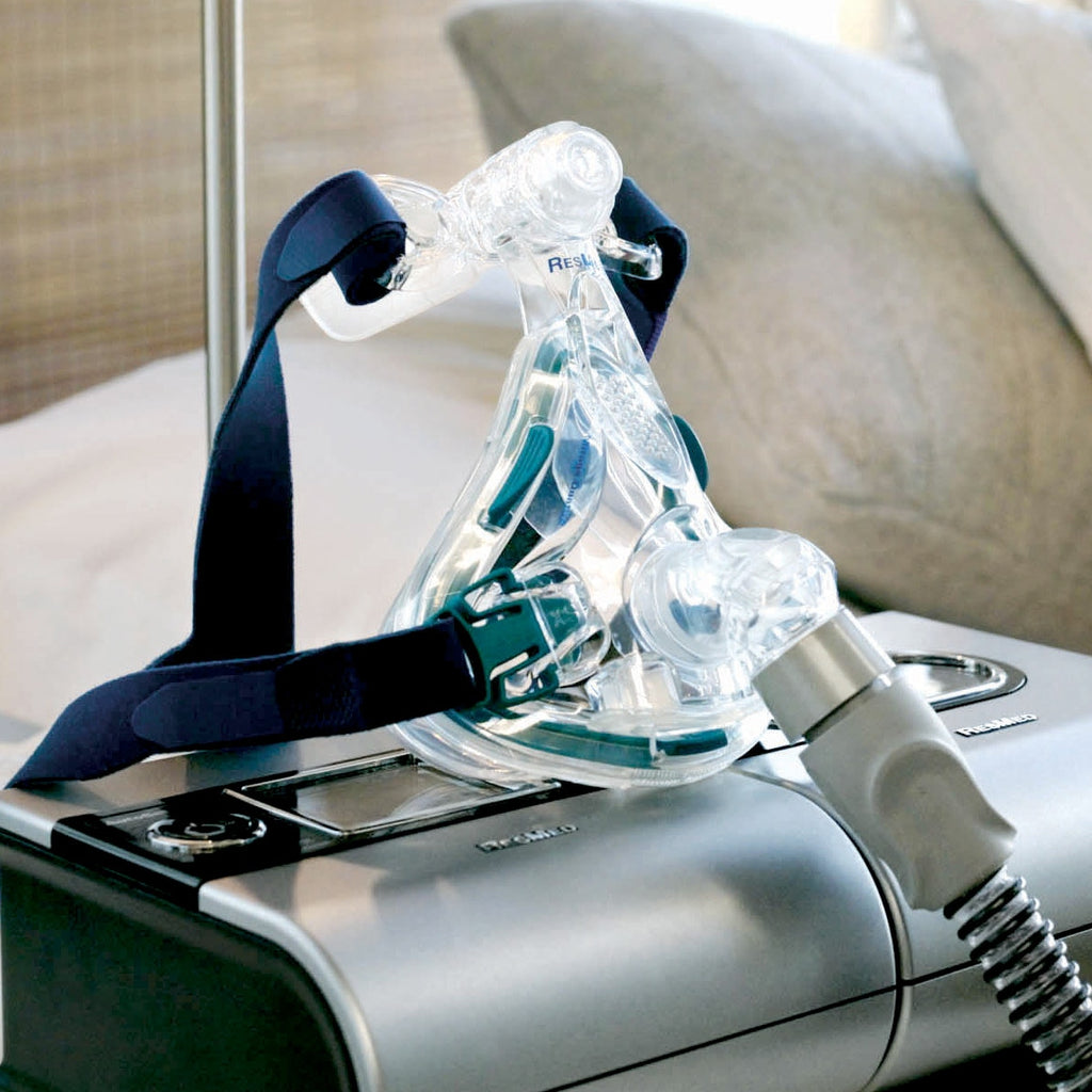Mirage Quattro Full Face Mask ob top of a CPAP Machine 