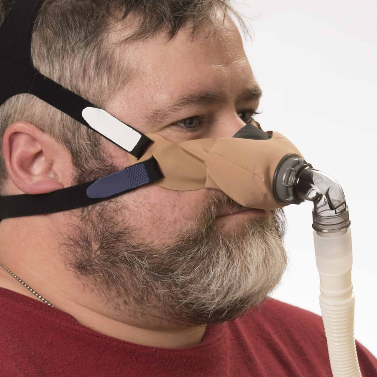 Man Wearing a beige Sleepweaver Elan Mask 